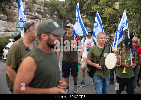 Kedumim, Israel. 24th Aug, 2023. Protestors chant slogans during a demonstration of 'Brothers in Arms', Israeli reservists organization against the judicial overhaul in front of Bezalel Smotrich - Minister of Finance house in the occupied West Bank settlement of Kedumim. Credit: SOPA Images Limited/Alamy Live News Stock Photo