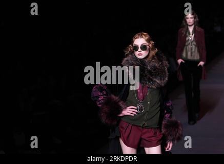 Paris, March 5 (Xinhua) -- A model presents a creation by British designer John Galliano for Christian Dior during the Fall-Winter 2011/2012 women s ready-to-wear fashion collection during Paris Fashion Week, in Paris, France, March 4, 2011. (Xinhua/Gao Jing) (jl) FRANCE-PARIS-FASHION-CHRISTIAN DIOR PUBLICATIONxNOTxINxCHN Stock Photo