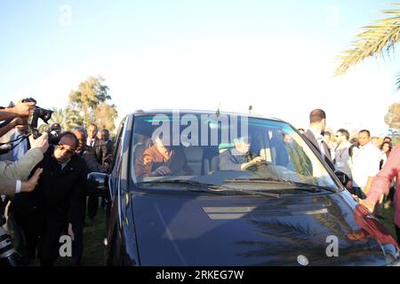 Bildnummer: 55251140  Datum: 10.04.2011  Copyright: imago/Xinhua (110410) -- TRIPOLI, April 10, 2011 (Xinhua) -- Libyan leader Muammar Gaddafi sits in a car after meeting with the African delegation, who arrived in Libya to try to negotiate a truce between xGaddafix s forces and rebels seeking to oust him, in Tripoli, capital of Libya, April 10, 2011. (Xinhua/Hamza Turkia) LIBYA-TRIPOLI-xGADDAFIx-AFRICAN DELEGATION PUBLICATIONxNOTxINxCHN People Politik premiumd kbdig xkg 2011 quer    Bildnummer 55251140 Date 10 04 2011 Copyright Imago XINHUA  Tripoli April 10 2011 XINHUA Libyan Leader Muammar Stock Photo