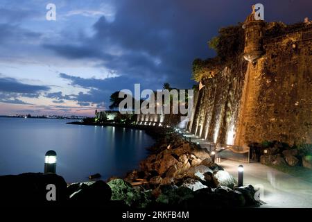 (110524) -- WASHINGTON D.C., May 24, 2011 (Xinhua) -- Photo taken on May 18, 2011 shows a watch tower and part of city wall in San Juan, Puerto Rico. Between the 15th and 19th centuries, a series of defensive structures was built at this strategic point in the Caribbean Sea to protect the city and the Bay of San Juan. The main elements of the massive fortification of San Juan are La Fortaleza, the three forts of San Felipe del Morro, San Cristobal and San Juan de la Cruz (El Canuelo), and a large portion of the City Wall. They represent a fine display of European military architecture adapted Stock Photo