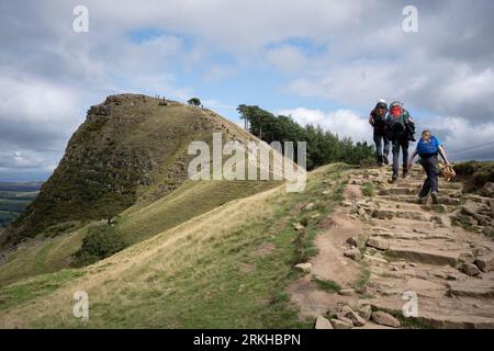 Family walkers and long-distance hikers climb the footpath along the ridge from Hollins Cross towards Back Tor in the Peak District National Park, on 23rd August 2023, in Sheffield, England. Stock Photo