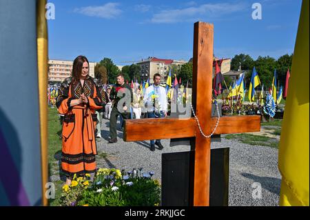 Lviv, Ukraine. 24th Aug, 2023. LVIV, UKRAINE - AUGUST 24, 2023 - Participants of the commemoration ceremony for Ukrainian defenders who died in the war with Russia, at the military cemetery in Lviv, western Ukraine. Credit: Ukrinform/Alamy Live News Stock Photo