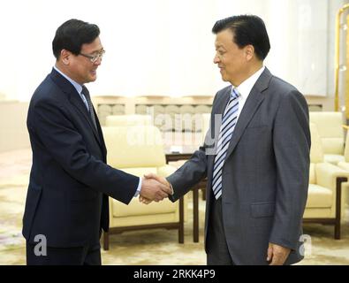 Bildnummer: 56199921  Datum: 20.10.2011  Copyright: imago/Xinhua (111020) -- BEIJING , Oct. 20, 2011 (Xinhua) -- Liu Yunshan (R), head of the Publicity Department of the Central Committee of the Communist Party of China, shakes hands with Kim Pyong Ho, director general of Korean Central News Agency (KCNA) of the Democratic People s Republic of Korea (DPRK), in Beijing, capital of China, Oct. 20, 2011. (Xinhua/Huang Jingwen) (llp) CHINA-BEIJING-LIU YUNSHAN-DPRK-MEETING (CN) PUBLICATIONxNOTxINxCHN People Politik xns x0x 2011 quer      56199921 Date 20 10 2011 Copyright Imago XINHUA  Beijing OCT Stock Photo