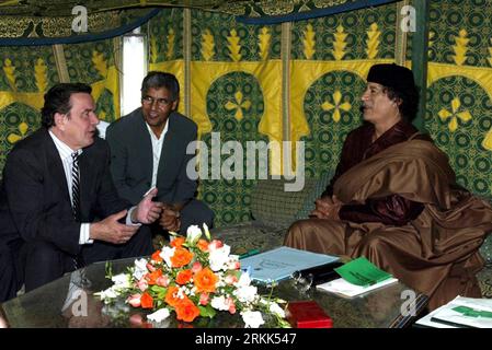 111020 -- BEIJING, Oct. 20, 2011 Xinhua -- File photo taken on Oct. 14, 2004 shows Muammar Gaddafi R meeting with former German Chancellor Gerhard Schroeder in Tripoli, Libya.   PUBLICATIONxNOTxINxCHN Stock Photo