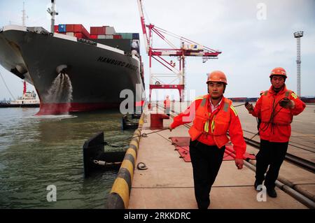 Bildnummer: 56228302  Datum: 29.10.2011  Copyright: imago/Xinhua (111029) -- QINGDAO, Oct. 29, 2011 (Xinhua) -- Panama-flagged freighter Hamburg Bridge, now under investigation, docks at the port of Qingdao, east China s Shandong Province, Oct. 29, 2011. The freighter collided with Oriental Sunrise, another Panama-flagged cargo ship, at 7:35 p.m. Friday Beijing Time (1135 GMT) in the nearby waters of Qingdao, causing the latter to sink. Of the 9 rescued crew members on board the Oriental Sunrise, 1 were found dead. Search is in progress for the rest 10, who are still missing. (Xinhua/Yu Fangpi Stock Photo