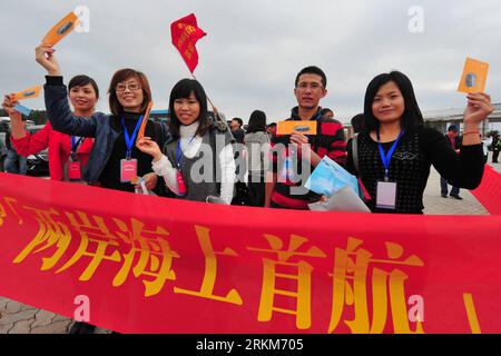 Bildnummer: 56534936  Datum: 30.11.2011  Copyright: imago/Xinhua (111130) -- PINGTAN, Nov. 30, 2011 (Xinhua) -- Passengers show their tickets before boarding a ship to leave Pingtan Island, southeast China s Fujian Province, for Taichung City, southeast China s Taiwan, Nov. 30, 2011. Fujian s Pingtan comprehensive experiment zone and Taiwan s Taichung on Wednesday saw the first voyage of the high-speed passenger ship, which carried 507 on board. The four-storey ship, with capacity of carrying 760 passengers and 260 cars, is expected to offer conveniency for personnel exchanges and help boost t Stock Photo