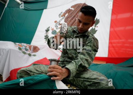 Mexiko Stadt, Mexico. 25th Aug, 2023. A member of the armed forces works on a flag of Mexico during preparations for the country's 213th Independence Day. Ceremonial parades are to be held on September 15 and 16. Credit: Gerardo Vieyra/dpa/Alamy Live News Stock Photo