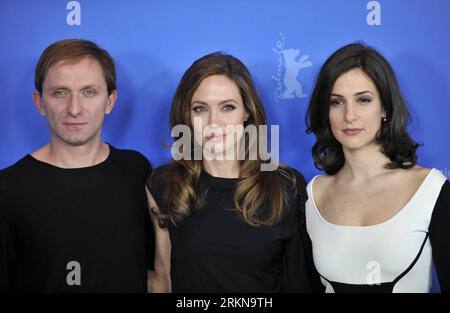 Bildnummer: 57054977  Datum: 11.02.2012  Copyright: imago/Xinhua (120211) -- BERLIN, Feb. 11, 2012 (Xinhua) -- US actress and director Angelina Jolie (C) poses with cast member Goran Kostic (L) and Zana Marjanovic during a photocall to promote her movie In the Land of Blood and Honey at the 62nd Berlinale film festival in Berlin, capital of Germany on Feb. 11, 2012. (Xinhua/Ma Ning) (yt) GERMANY-BERLINALE FILM FESTIVAL-IN THE LAND OF BLOOD AND HONEY PUBLICATIONxNOTxINxCHN People Film Entertainment Kultur Film 62. Internationale Filmfestspiele Berlinale xda x0x 2012 quer      57054977 Date 11 0 Stock Photo