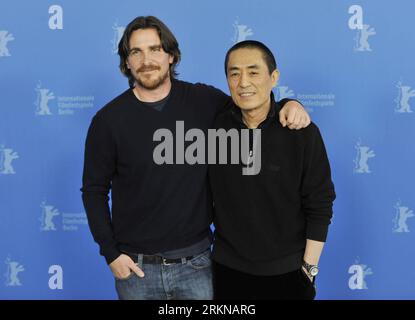 Bildnummer: 57066942  Datum: 13.02.2012  Copyright: imago/Xinhua (120213) -- BERLIN, Feb. 13, 2012 (Xinhua) -- Chinese director Zhang Yimou (R) poses during a photocall to promote his movie The Flowers of War with actor Christian Bale at the 62nd Berlinale film festival in Berlin, capital of Germany, on Feb. 13, 2012. (Xinhua/Ma Ning) (zl) GERMANY-BERLINALE FILM FESTIVAL-THE FLOWERS OF WAR PUBLICATIONxNOTxINxCHN Kultur Entertainment People Film 62. Internationale Filmfestspiele Berlinale Berlin Photocall xjh x0x premiumd 2012 quer      57066942 Date 13 02 2012 Copyright Imago XINHUA  Berlin Fe Stock Photo