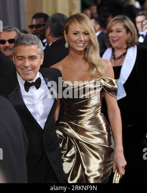 Bildnummer: 57111155  Datum: 26.02.2012  Copyright: imago/Xinhua (120227) -- HOLLYWOOD, Feb. 26, 2012 (Xinhua) -- Actor George Clooney and Stacy Keibler arrives on the red carpet for the 84th Annual Academy Awards in Hollywood, California, the United States, Feb. 26, 2012. (Xinhua/Yang Lei)(msq) U.S.-HOLLYWOOD-OSCARS-RED CARPET PUBLICATIONxNOTxINxCHN Kultur Entertainment People Film 84. Annual Academy Awards Oscar Oscars Hollywood premiumd xsp x1x 2012 hoch Highlight o0 Freundin, Frau, Familie, Privat, Mann, Freund     57111155 Date 26 02 2012 Copyright Imago XINHUA  Hollywood Feb 26 2012 XINH Stock Photo