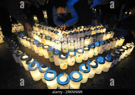 Bildnummer: 57352364  Datum: 11.03.2012  Copyright: imago/Xinhua (120311) -- FUKUSHIMA, March 11, 2012 (Xinhua) -- light candles during a memorial service marking the first anniversary of the March 11, 2011 earthquake and tsunami in Fukushima, Japan, on March 11, 2012. Some 500 residents from the quake-shaken Fukushima, Iwate and Miyagi attended the memorial service on Sunday.(Xinhua/Kenichiro Seki) (ybg) JAPAN-FUKUSHIMA-EARTHQUAKE-ANNIVERSARY-CANDLES PUBLICATIONxNOTxINxCHN Gesellschaft Naturkatastrophe Katastrophe Jahrestag Gedenken Trauer Kerze premiumd xbs x0x 2012 quer      57352364 Date 1 Stock Photo