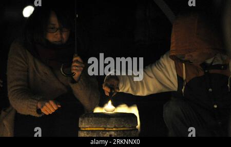 Bildnummer: 57352366  Datum: 11.03.2012  Copyright: imago/Xinhua (120311) -- FUKUSHIMA, March 11, 2012 (Xinhua) -- light candles during a memorial service marking the first anniversary of the March 11, 2011 earthquake and tsunami in Fukushima, Japan, on March 11, 2012. Some 500 residents from the quake-shaken Fukushima, Iwate and Miyagi attended the memorial service on Sunday.(Xinhua/Kenichiro Seki) (ybg) JAPAN-FUKUSHIMA-EARTHQUAKE-ANNIVERSARY-CANDLES PUBLICATIONxNOTxINxCHN Gesellschaft Naturkatastrophe Katastrophe Jahrestag Gedenken Trauer Kerze premiumd xbs x0x 2012 quer      57352366 Date 1 Stock Photo