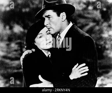 Jean Sullivan, Errol Flynn, sul set di The Film, 'Uncertain Glory', Warner Bros., 1944 Foto Stock