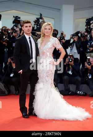 Bildnummer: 58412420  Datum: 31.08.2012  Copyright: imago/Xinhua U.S. actor Zac Efron (L) and actress Maika Monroe pose on the red carpet for the premiere of the film At Any Price during the 69th Venice International Film Festival in Venice, Italy, Aug. 31, 2012. (Xinhua/Wang Qingqin) ITALY-VENICE-FILM FESTIVAL- AT ANY PRICE -PREMIERE PUBLICATIONxNOTxINxCHN Kultur Entertainment People Film 69. Internationale Filmfestspiele Venedig Filmpremiere Premiere x0x xds 2012 hoch Aufmacher premiumd     58412420 Date 31 08 2012 Copyright Imago XINHUA U S Actor Zac Efron l and actress Maika Monroe Pose ON Stock Photo