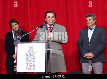 Bildnummer: 59046541  Datum: 11.01.2013  Copyright: imago/Xinhua LOS ANGELES, Jan. 11, 2013 - Li Dongsheng (C), chairman of the Board and Chief Executive Officer of TCL Corporation, speaks during a ceremony at Grauman s Chinese Theatre in Hollywood, Los Angeles, the United States, on Jan. 11, 2013. The renowned Grauman s Chinese Theatre in Hollywood, Los Angeles, was renamed the TCL Chinese Theatre on Friday, after TCL Corporation, a major Chinese electronics company, bought the naming rights for 10 years. (Xinhua/Xue Ying) US-LOS ANGELES-TCL-CHINESE THEATRE PUBLICATIONxNOTxINxCHN Wirtschaft P Stock Photo