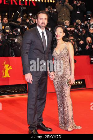 Bildnummer: 59226596  Datum: 15.02.2013  Copyright: imago/Xinhua (130215) -- BERLIN, Feb. 15, 2013 (Xinhua) -- Actor Nicholas Cage and his wife Alice Kim pose on the red carpet for the screening of the film The Croods at the 63rd Berlinale International Film Festival in Berlin, Germany, Feb. 15, 2013. (Xinhua/Yan Ting) GERMANY-BERLIN FILM FESTIVAL-THE CROODS PUBLICATIONxNOTxINxCHN Kultur Entertainment People Film 63. Internationale Filmfestspiele Berlinale Berlin Filmpremiere Premiere xns x1x 2013 hoch  o0 Familie, privat, Frau,     59226596 Date 15 02 2013 Copyright Imago XINHUA  Berlin Feb 1 Stock Photo