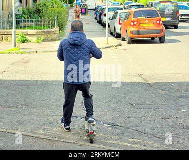 Glasgow, Scotland, UK. 26tht August, 2023. UK Weather:  Electric scooter on the pavement crossing road. Sunny in the city saw locals ant tourists make the most of the city centre.  Credit Gerard Ferry/Alamy Live News Stock Photo