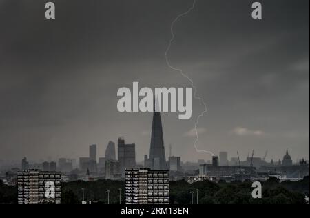 London, UK. 26th August, 2023. UK Weather: Dramatic lightning over the city sees a strike land and discharge near The Shard skyscraper. Credit: Guy Corbishley/Alamy Live News Stock Photo