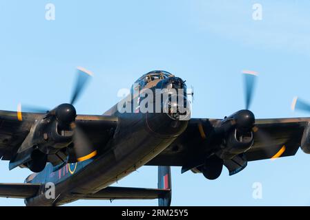 RAF Battle of Britain Memorial Flight Avro Lancaster bomber plane taking off low at London Southend Airport, Essex, UK. Bomb-aimers nose blister Stock Photo