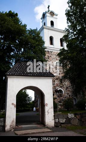 Photo taken on June 23, 2013 shows the outside of the mid-15th-century Holy Cross Church in Old Rauma, Finland. Situated on the Gulf of Botnia, southwest Finland, Old Rauma is the largest unified historical wooden town in the Nordic countries with an area of 28 hectares and 600 buildings. Built around a Franciscan monastery, where the mid-15th-century Holy Cross Church still stands, it is an outstanding example of an old Nordic city constructed with woods. Although ravaged by fire in the late 17th century, it has preserved its ancient appearance. Old Rauma was inscribed onto the list of the UN Stock Photo