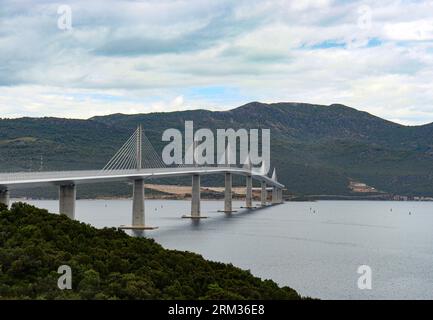 Pelješac bridge in Croatian Dalmatia coast over the adriatic sea on a cloudy day Stock Photo