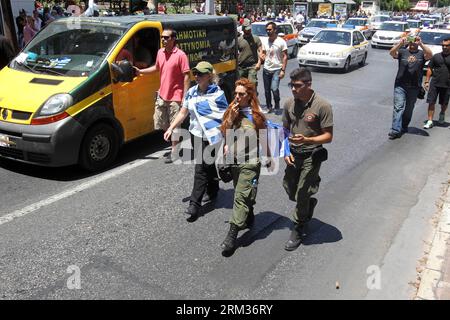 Bildnummer: 60058589  Datum: 08.07.2013  Copyright: imago/Xinhua (130708) -- ATHENS, July 8, 2013 (Xinhua) -- Protesters attend a demonstration in Athens, July 8, 2013. The federations of civil servants and municipal workers organized a strike and demonstration against the Greek government s plans for labor mobility and 15,000 layoffs in the public sector and municipalities.(Xinhua/Marios Lolos) (dzl) GREECE-ATHENS-DEMONSTRATION PUBLICATIONxNOTxINxCHN Politik Streik Demo Protest premiumd x0x xsk 2013 quer premiumd      60058589 Date 08 07 2013 Copyright Imago XINHUA  Athens July 8 2013 XINHUA Stock Photo