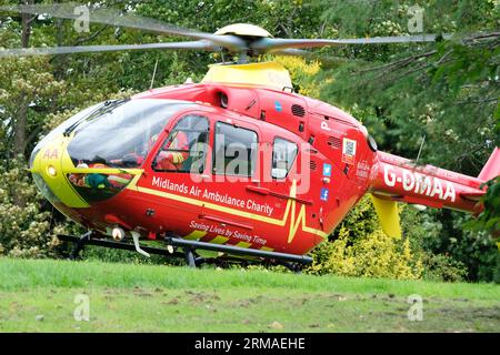 Midlands Air Ambuance EC135 helicopter lands in a public park in Hereford UK in August 2023 Stock Photo