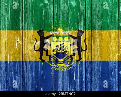 Bandiera e stemma della Repubblica del Gabon su sfondo testurizzato. Collage concettuale. Foto Stock