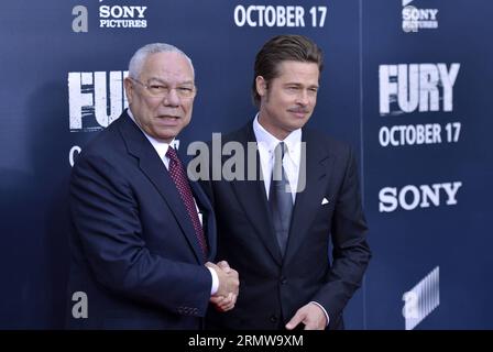 WASHINGTON, 15 ottobre 2014 - l'attore Brad Pitt R e l'ex Segretario di Stato degli Stati Uniti Colin Powell partecipano alla prima mondiale del nuovo film di Pitt Fury a Washington D.C., 15 ottobre 2014. U.S.-WASHINGTON-BRAD PITT-FILM FURY PREMIERE YINXBOGU PUBLICATIONXNOTXINXCHN Foto Stock