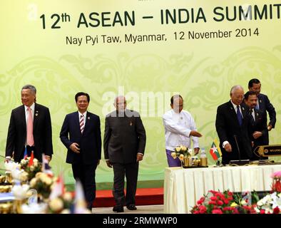 (141112) -- NAY PYI TAW, 12 novembre 2014 -- i partecipanti camminano fino ai loro posti dopo la sessione fotografica davanti al 12° vertice ASEAN-INDIA a Nay Pyi Taw, Myanmar, 12 novembre 2014. ) MYANMAR-NAY PYI TAW-ASEAN-INDIA SUMMIT LixPeng PUBLICATIONxNOTxINxCHN Nay Pyi Taw Nov 12 2014 partecipanti camminano verso il loro dopo la sessione fotografica in vista del 12 ° ASEAN India Summit a Nay Pyi Taw Myanmar Nov 12 2014 Myanmar Nay Pyi Taw ASEAN India Summit PUBLICATIONTxINxCHN Foto Stock