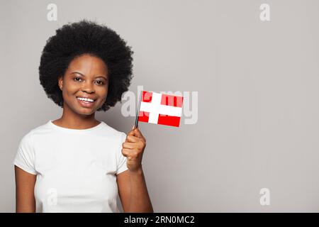 Danish woman holding flag of Denmark Education, business, citizenship and patriotism concept Foto Stock