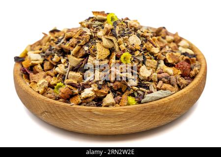 Dried winter tea. Sun-dried winter tea in wood bowl isolated on white background. herbal medicine Stock Photo