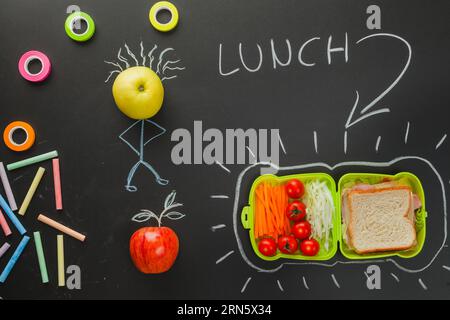 Tavola nera che mostra l'ora del pranzo Foto Stock