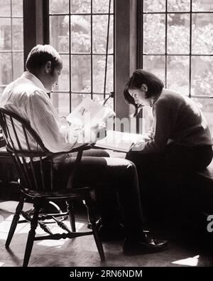 1960s TWO UNIVERSITY STUDENTS MAN AND WOMAN SITTING BY SUNNY WINDOW READING IN LIBRARY TEMPLE UNIVERSITY PHILADELPHIA PA USA - s17256 HAR001 HARS ABSTRACT LIFESTYLE FEMALES COPY SPACE FRIENDSHIP HALF-LENGTH LADIES PERSONS QUIET INSPIRATION MALES SUNLIGHT SUNNY B&W FREEDOM TEMPLE HIGH ANGLE DISCOVERY UNIVERSITIES AND KNOWLEDGE PA OPPORTUNITY HIGHER EDUCATION CONCEPTUAL STYLISH SUNLIT SUPPORT COLLEGES TOGETHERNESS YOUNG ADULT MAN YOUNG ADULT WOMAN BLACK AND WHITE CAUCASIAN ETHNICITY HAR001 OLD FASHIONED Stock Photo