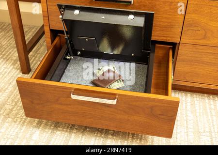 Money and valuables in hotel room safe Stock Photo