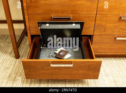 Money and valuables in hotel room safe Stock Photo