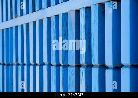 Close up weathered blue wooden gate Stock Photo