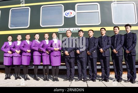 (151018) -- URUMQI, Oct. 18, 2015 -- Staff members of an intercity train poses for photo in Urumqi, capital of northwest China s Xinjiang Province, Oct. 18, 2015. A new intercity train linking Urumqi and Korla will be operated from Oct. 20 with 121 staff members from different ethnic groups. ) (zhs) CHINA-XINJIANG-NEW INTERCITY TRAIN (CN) ZhaoxGe PUBLICATIONxNOTxINxCHN   Urumqi OCT 18 2015 Staff Members of to Inter-City Train Poses for Photo in Urumqi Capital of Northwest China S Xinjiang Province OCT 18 2015 a New Inter-City Train Linking Urumqi and Korla will Be Operated from OCT 20 With 121 Stock Photo