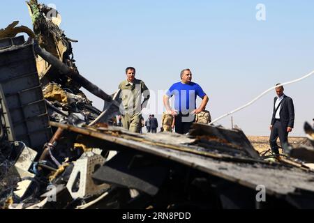 (151101) -- ARISH CITY, Nov. 1, 2015 -- Russian Minister for Civil Defense, Emergencies and Natural Disasters Puchkov Vladimir Andreevich (C) is seen at the crash site of a Russian passenger airplane which crashed at the Hassana area in Arish city, north Egypt, on Nov. 1, 2015. Egyptian and international investigators on Sunday have begun probing the reasons of the Russian plane that crashed in Egypt s Sinai peninsula on Saturday which killed all 224 on board. ) EGYPT-RUSSIA-TRANSPORT MINISTER-PLANE-CRASH-INVESTIGATION AhmedxGomaa PUBLICATIONxNOTxINxCHN   Arish City Nov 1 2015 Russian Minister Stock Photo