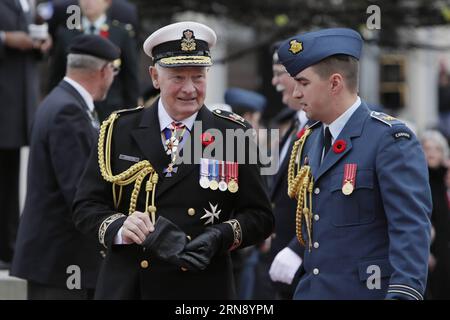 (151111) -- OTTAWA, Nov. 11, 2015 -- Canada s Governor General David Johnston (L) arrive at the annual Remembrance Day ceremony at the National War Memorial in Ottawa, Canada, on Nov. 11, 2015. Every year on Nov. 11, Canadians reflect honour their war veterans and fallen soldiers by wearing a poppy and observing a moment of silence on the 11th minute of the 11th hour. ) CANADA-OTTAWA-REMEMBRANCE DAY-CEREMONY DavidxKawai PUBLICATIONxNOTxINxCHN   151111 Ottawa Nov 11 2015 Canada S Governor General David Johnston l Arrive AT The Annual Remembrance Day Ceremony AT The National was Memorial in Otta Stock Photo