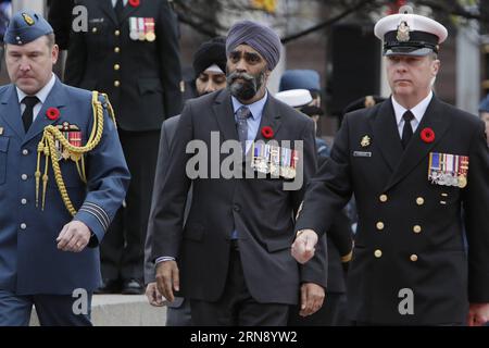 (151111) -- OTTAWA, Nov. 11, 2015 -- Canada s new Defence Minister Harjit Singh Sajjan arrives at the annual Remembrance Day ceremony at the National War Memorial in Ottawa, Canada, on Nov. 11, 2015. Every year on Nov. 11, Canadians reflect honour their war veterans and fallen soldiers by wearing a poppy and observing a moment of silence on the 11th minute of the 11th hour. ) CANADA-OTTAWA-REMEMBRANCE DAY-CEREMONY DavidxKawai PUBLICATIONxNOTxINxCHN   151111 Ottawa Nov 11 2015 Canada S New Defence Ministers  Singh Sajjan arrives AT The Annual Remembrance Day Ceremony AT The National was Memoria Stock Photo