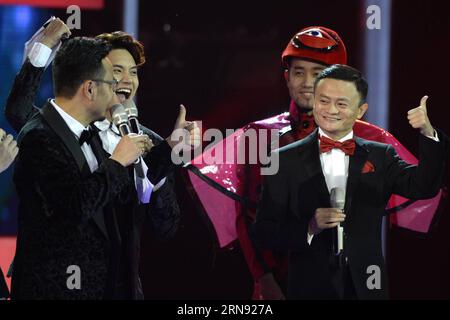 (151115) -- BEIJING, Nov. 10, 2015 -- Jack Ma (R front), founder and chairman of China s e-commerce giant Alibaba, interacts with customers through TV during the Tmall 2015 Singles Day Carnival Night at the National Aquatics Center in Beijing, capital of China, Nov. 10, 2015. The transaction volume of Tmall, a business-to-consumer marketplace of China s biggest e-commerce platform Alibaba,topped 10 billion yuan (about 1.6 billion dollars) in the first 13 minutes of the Singles Day which fell on Nov. 11, setting a new record for its past marks, and its transaction volume in 4.5 hours passed its Stock Photo