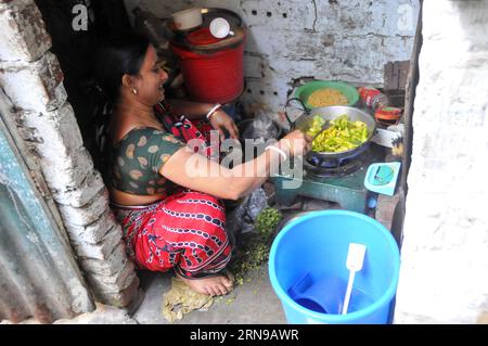 A Bangladeshi woman cooks meal at an old building in the old part of Dhaka, Bangladesh, Nov. 26, 2015. )(azp) BANGLADESH-DHAKA-DAILY LIFE SharifulxIslam PUBLICATIONxNOTxINxCHN   a Bangladeshi Woman Cooks Meal AT to Old Building in The Old Part of Dhaka Bangladesh Nov 26 2015 EGP Bangladesh Dhaka Daily Life SharifulxIslam PUBLICATIONxNOTxINxCHN Stock Photo