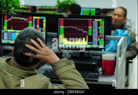 (151127) -- JIUJIANG, Nov. 27, 2015 -- Investors look through stock information at a trading hall of a securities firm in Jiujiang, east China s Jiangxi Province, Nov. 27, 2015. China s stocks tumbled heavily in the afternoon session Friday, with the benchmark Shanghai Composite Index nosediving 5.5 percent to 3,436.3 points, and the Shenzhen Component Index closed 6.3 percent lower at 11,961.7 points, the sharpest fall since the rout that led to summer s low of August 17. ) (lfj) CHINA-STOCKS-PLUNGE (CN) HuxGuolin PUBLICATIONxNOTxINxCHN   151127 Jiujiang Nov 27 2015 Investors Look Through Sti Stock Photo