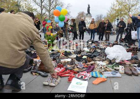 (151129) -- PARIS, Nov. 29, 2015 -- Picture taken on Nov. 29, 2015 shows some of the shoes on the Place de la Republique in downtown Paris, France, as part of a peaceful rally called by the NGO Avaaz Paris sets off for climate , as an attempt to protest the French authorities ban on public gatherings. In the wake of the bloody wave of explosions and shootings which left 130 people dead on Nov. 13, France banned massive marches planned in public places in Paris and other French cities . ) FRANCE-PARIS-PROTEST LixGenxing PUBLICATIONxNOTxINxCHN   151129 Paris Nov 29 2015 Picture Taken ON Nov 29 2 Stock Photo