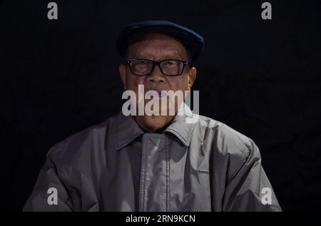 NANJING, Dec. 08, 2015 -- Xiang Yuansong, 87, survivor of the atrocious Nanjing Massacre, sits at home in Nanjing, capital of east China s Jiangsu Province, on Dec. 8, 2015. Xiang Yuansong survived in the Nanjing Massacre when he was 9 years old. His elder brother Xiang Yuangao, and one of his uncle Xiang Zhonglin were killed by Japanese army at Xiaguan of Nanjing in the massacre. Some survivors of the Nanjing Massacre held family memorial rites for their lost relatives at the Memorial Hall of the Victims in the Nanjing Massacre by Japanese Invaders on Thursday, ahead of the national memorial Stock Photo