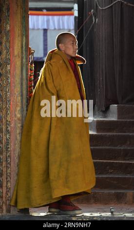 (151213) -- XIGAZE, Dec. 13, 2015 -- A monk waits for the coming of Bainqen Erdini Qoigyijabu, the 11th Panchen Lama, one of the two most revered living Buddhas in Tibetan Buddhism, at the Tashilumpo Monastery in Xigaze, southwest China s Tibet Autonomous Region, Dec. 13, 2015. ) (yxb) CHINA-TIBET-11TH PANCHEN LAMA-BUDDHISM (CN) Chogo PUBLICATIONxNOTxINxCHN   151213 Xigaze DEC 13 2015 a Monk Waits for The Coming of Bainqen Erdini Qoigyijabu The 11th Panchen Lama One of The Two Most onscreen revered Living Buddha in Tibetan Buddhism AT The Tashilumpo monastery in Xigaze Southwest China S Tibet Stock Photo