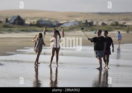 (160116) -- CABO POLONIO, Jan. 15, 2016 -- People get fun on the north beach of Cabo Polonio, Rocha department, 275km from Montevideo, capital of Uruguay, on Jan. 15, 2016. According to local press, Cabo Polonio National Park is a protected area of Uruguay, which since 2009 is part of the national system of protected areas. It is a place that has no electricity or running water, so the houses are lit by candles, lanterns or solar energy, and the water is extracted by a pump or a well and is heated with gas. The entry of tourists to the park is through trucks 4X4. Nicolas Celaya) URUGUAY-CABO P Stock Photo