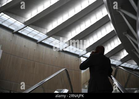 (160129) -- ADDIS ABABA, Jan. 29, 2016 -- A man uses a cellphone on an escalator at the African Union (AU) Headquarters in Addis Ababa, Ethiopia, on Jan. 29, 2016. The summit of the AU heads of states will be held from Jan. 30 to 31, under the theme of Year of Human Rights, with a special focus on the rights of women. ) ETHIOPIA-ADDIS ABABA-26TH AU SUMMIT PanxSiwei PUBLICATIONxNOTxINxCHN   Addis Ababa Jan 29 2016 a Man Uses a cellphone ON to Escalator AT The African Union Au Headquarters in Addis Ababa Ethiopia ON Jan 29 2016 The Summit of The Au Heads of States will Be Hero from Jan 30 to 31 Stock Photo