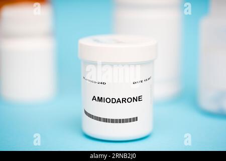 Amiodarone is a medication that is used to treat irregular heartbeats. It is available in tablet or intravenous injection form. Stock Photo
